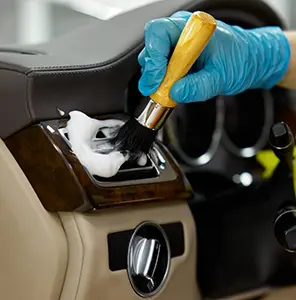 worker-disassembling-car-interior