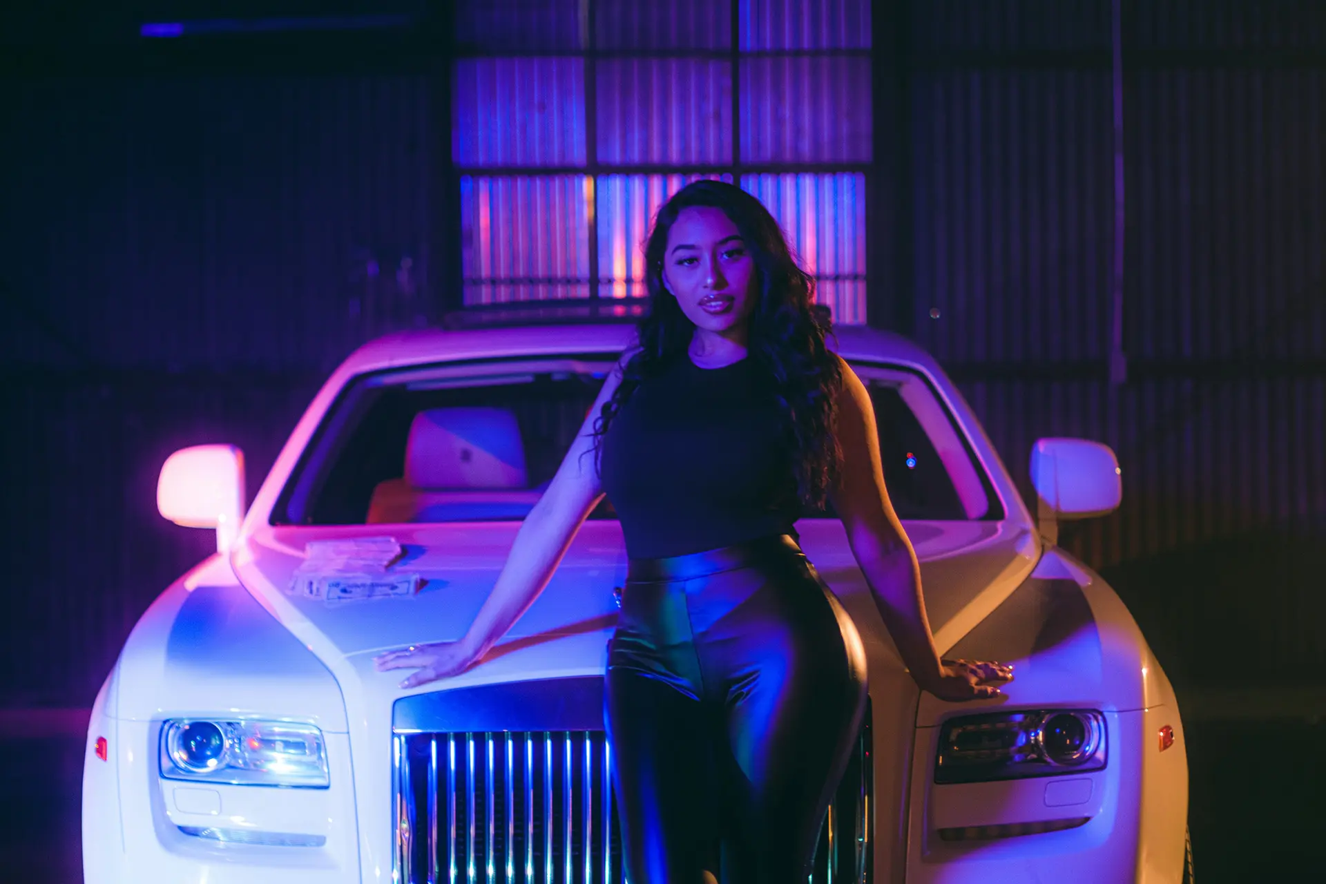 worker-cleaning-modern-vehicle-alloy-wheels